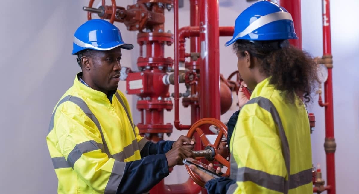 two fire pump testing experts working on fire pump